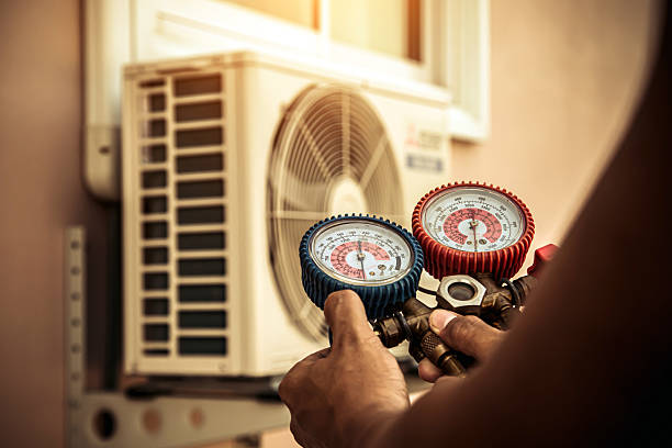 Professional Heat Pump Repair technician working in Central Village, CT